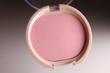 Pink powder blush for cheeks. Face cosmetics.