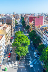 Aerial view of a boulevard passing Torres de Quart in Valencia, Spain