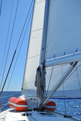 Sailing yacht on the in motion with open sails