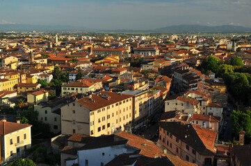 Fototapeta na wymiar View from the height of a bird on the small town roofs in Italy