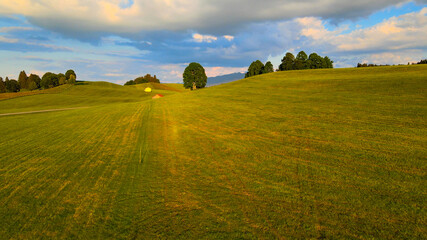 Flight over the beautiful rural landscape of Bavaria Allgau in the German Alps. Aerial view