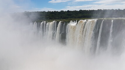 photograph of the famous, grandiose and mighty Iguazu Falls, which give off magical water vapor, seen from the Brazilian side