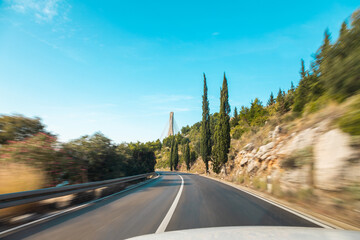 driving on a road along the azure coast of France