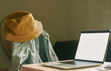  Travel planning ideas by placing a laptop on a desk and a new travel kit                        
