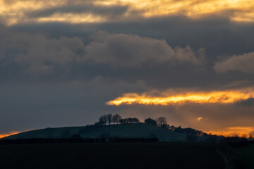 Naklejka na ściany i meble Winter sunset with dramatic clouds in England