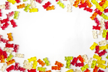 Colorful jelly candy on white background, top view, flat lay