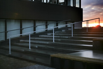 Fototapeta premium empty staircase and modern business office building, sunset sky