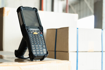Bluetooth barcode scanner on shipment boxes, Manufacturing cargo warehouse export. Computer equipment for inventory management.