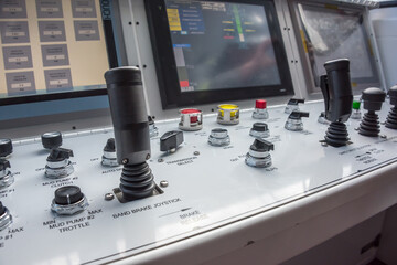 Oil rig computer controls & switches in operators room on rig floor.