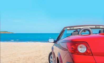 Red car on the beach. Cars on the beach. Vacation and freedom concept.