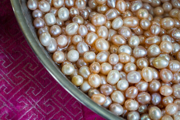 pearl necklace in a bowl