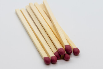 matches with red head, on a white background , studio photography