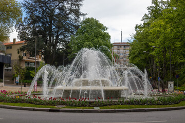 Fototapeta premium Water fountain at the roundabout in Rossio Square, in Viseu