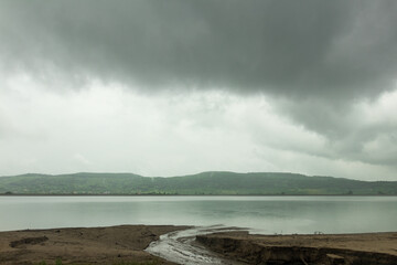 The lake in a cloudy day rain and reflections