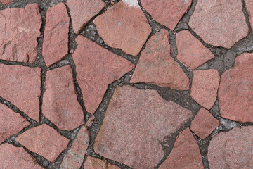 Stone wall for backdrop. Loose wide seams at the joints. Granite color - Hemp, Hue Brown.