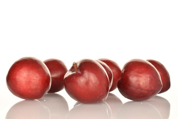 Fresh ripe, organic red plum, close-up, on a white background.
