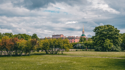 Panoramic view of the summer cityscape in St. Petersburg. Russia. Green lawn in field of Mars