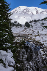 A light dusting of snow and a partially frozen Myrtle Falls in Mt. Rainier National Park