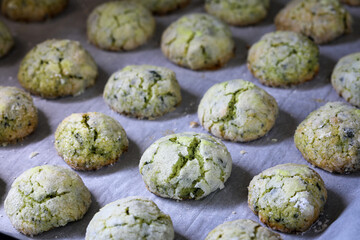 Mint green cookies with cracked sugar icing.
