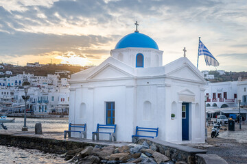 Agios Nikolaos Church - Most famous church of Mykonos Island, Greece at sunrise / Golden hour