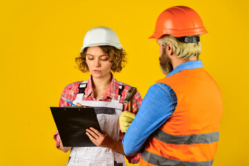 work at construction site or factory. Civil engineering. industrial business partner. job and occupation. confident electrical and technician. engineers couple working together on building blueprint