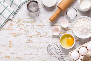 Fototapeta na wymiar Ingredients for baking - flour, eggs, salt, sugar, milk.