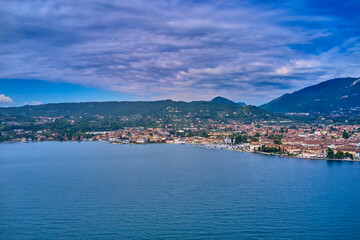 High Altitude Coastline Panorama. Aerial view of the city of Salò, Lake Garda, Italy. 