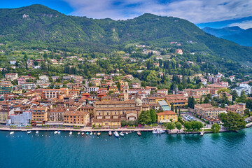 The historical part of the Italian city on the water. Aerial view of the city of Salò, Lake Garda, Italy. 