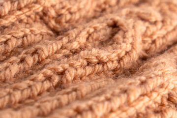 Wool hand knit pattern. Orange wool knitting texture background