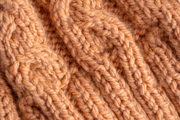 Wool hand knit pattern. Orange wool knitting texture background