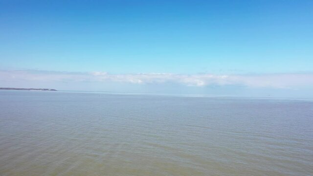 An aerial view of an empty sandy beach. Pandemic quarantine. Whitstable, Kent, UK