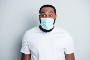 Photo of crazy terrified dark skin african guy protester community protest demonstration lawlessness see police frightened guns wear t-shirt facial mask isolated grey color background