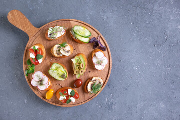Delicious vegetarian bruschetta with tomatoes, avocado, mushrooms and herbs. Beautifully designed catering Banquet menu. Easy to cook, nutritious snack. Food snacks and snacks for the buffet.