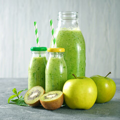 Green smoothie with organic green fruits. Detox juice. Square photo.