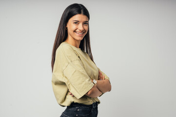 Portrait of young beautiful beautiful cheerful smiling girl looking at camera on white background.