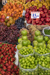 Naklejka na ściany i meble Varieties of Organic Spring Fruits in a Traditional Daily Market in Tehran