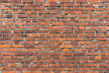 brick red wall. background of a old brick house.