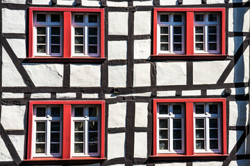 Fachwerk or timber frame houses red windows in Monschau - town in Germany - a small resort town in...