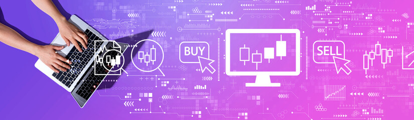 Stock trading theme with woman using a laptop computer