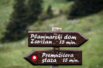 Direction signpost for hikers. Zavižan mountain hut and Premužićeva trail are most famous localities in the Northern Velebit National Park in Croatia.