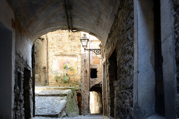 very narrow street in typical mediterranean village