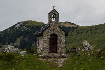 Fototapeta na wymiar Mountain chapel in Zavižan. Zavižan is one of the best-known localities in the Northern Velebit National Park. 