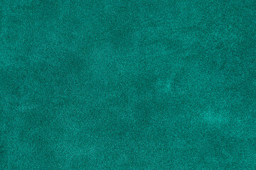 Teal leather texture background. closeup view of suede