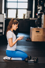 Portrait of attractive young woman doing yoga or pilates exercise