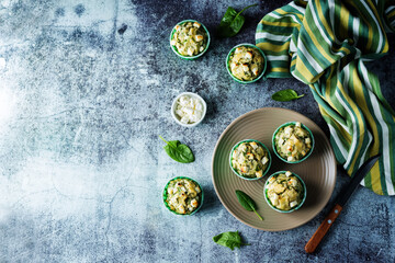 Spinach Feta cheese breakfast muffins with fresh spinach leaves