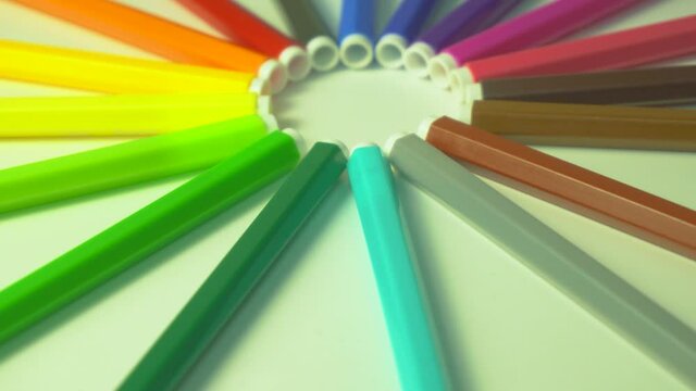Office consumables and supplies on white spinning table background.Colored felt-tip pens on a white background. Children's felt-tip pens