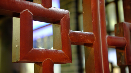 Fragment of a wooden ornament in a Chinese restaurant closeup photo