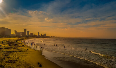 Durban golden mile beach with white sand and skyline South Africa during sunset and golden hour - obrazy, fototapety, plakaty