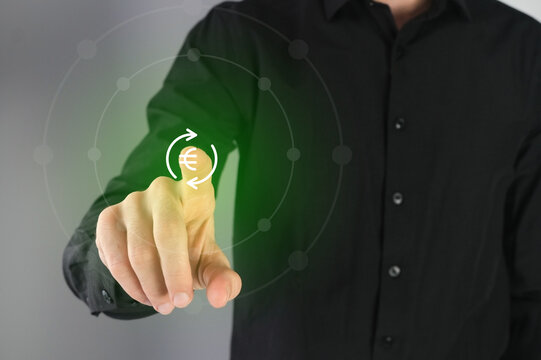 Currency exchange, business man pressing a  button on a virtual digital  interface. .