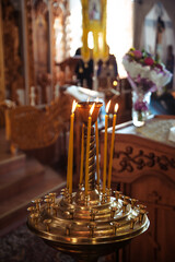 ambiance of church, candles and bokeh yellow lights
